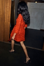 Red Sequin Mini Vienna Dress with long sleeves and a wrap waist, styled with leopard print heels.