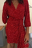 Red Sequin Mini Vienna Dress featuring a multi-wear wrap waist and long sleeves on a model.