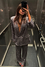 Thumbnail for Gunmetal Sequin Freddie Trousers and matching blazer styled as a shimmering party co-ord in an elevator selfie.