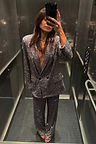 Gunmetal Sequin Freddie Trousers and matching blazer styled as a shimmering party co-ord in an elevator selfie.