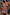 Thumbnail for Pink and blue Beaded Embroidered Shell Triangle Top with beadwork, shown on a model for a poolside vacation look.