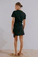 Black Crochet Shell Wrap Skirt featuring a tie-waist fastening and gold shell details, viewed from the back.