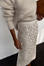 Thumbnail for Shells Dorris Skirt in cream featuring pearlescent shell beads and glass details, styled with a fuzzy jumper.