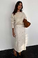 Cream Shells Dorris Skirt with pearlescent sea shell beads, paired with a knit jumper and brown clutch bag.