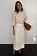 Thumbnail for Cream Shells Dorris Skirt with pearlescent shell beads, styled with a knit jumper and brown clutch bag.