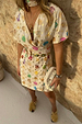 Cream Shell Mini Wrap Dress with colourful seashell motifs, V-neckline and adjustable wrap tie fastening.