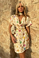Cream Shell Mini Wrap Dress featuring a colourful seashell print and a matching necktie accessory.