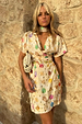 Cream Shell Mini Wrap Dress featuring a colourful seashell print and a matching necktie accessory.