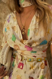 Cream Shell Mini Wrap Dress featuring multicoloured seashell motifs, gold foil and a wrap tie waist.