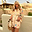Cream Shell Elissa Shorts with a colourful shell print and gold flecks, styled as a co-ord set for a vacation look.