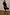 Thumbnail for Black Crochet Shell Wrap Skirt with gold shell details and a tie waist, styled with strappy sandals.