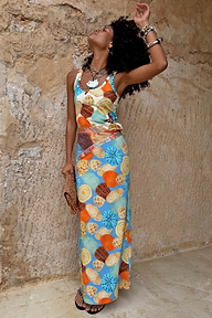 Shell Ribbed Skirt featuring a blue hand-painted shell print in sunset tones and sandy neutrals.