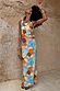 Shell Ribbed Skirt featuring a blue hand-painted shell print in sunset tones and sandy neutrals.