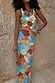 Shell Ribbed Skirt featuring a hand-painted shell print in blue and sunset tones, styled with a matching tank top.