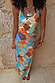 Shell Rib Tank featuring an ocean-toned abstract shell print, styled as a co-ord with a matching skirt and clutch.