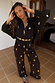 Black Shell Elissa Trousers in a cotton-linen blend with gold shell prints and a wide-leg fit, styled as a co-ord.