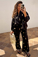 Black Shell Elissa Trousers with a gold shell print and wide-leg fit in a breathable cotton-linen blend.
