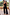 Thumbnail for Black Shell Elissa Trousers with gold seashell motifs and a wide-leg fit, styled in a mirror selfie.