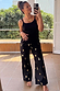 Black Shell Elissa Trousers with gold seashell motifs and a wide-leg fit, styled in a mirror selfie.