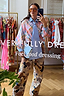 Pastel Check Shirt with a blue stripe pussy bow and camo trousers, shown in a feel good dressing mirror selfie.