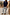 Thumbnail for Navy knit jumper dress with a striped cotton skirt, styled over jeans for a multi-wear London look.
