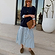 Navy Knit Jumper Dress with a blue striped cotton skirt and button front, styled with a brown suede clutch.