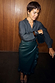 Thumbnail for Bottle Green Ruffle Miley Shirt with blouson sleeves, styled with a vegan leather wrap skirt and leopard print heels.