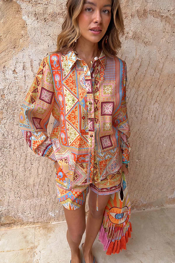 Dolce Vita Ellie Shorts in a colourful tile patchwork print, styled with a matching shirt for a co-ord look.