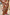 Thumbnail for Dolce Vita Ellie Shorts in a patchwork tile print with sun motifs, styled as a co-ord with a matching shirt.