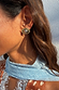 Deloris Silver Circle Earrings in textured brushed metal with vintage vibes, worn by a model with a blue lace scarf.