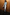 Thumbnail for Silver Vegan Leather Jaspre Skirt styled with a grey roll neck and brown boots against a wooden wall.