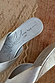 Silver Wedge Mule in metallic leather with a black sun illustration and branded script on the footbed.