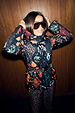 Night Garden Ski Jacket featuring a multi-print of leopard and poppy motifs with a belted waist and hood.