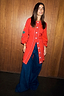 Red Ski Knit Long Cardigan featuring embroidered motifs and blue buttons, styled with wide-leg denim jeans.