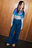 Blue Ski Slopes Mesh Long Sleeve Top with a sheer mountain print, paired with dark wash wide-leg denim jeans.