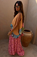 Pink Snake Balloon Trouser with dusky pink snake and swirl motifs, styled in a relaxed balloon silhouette.