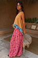 Pink Snake Balloon Trouser with dusky pink snake and swirl motifs, styled with a colourful patterned top.