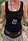 Deloris Mermaid Necklace with an engraved brass pendant on a black leather cord, styled for a multi-wear layered look.