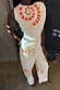 White Snake Tie Side Trousers in cotton twill with red snake and star motifs, styled as a co-ord with the matching top.