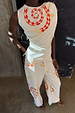 White Snake Tie Side Trousers in cotton twill with red snake and star motifs, styled as a co-ord with the matching top.