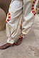 Snake Tie Side Trousers in white cotton with red snake and star motifs and multi-wear tie-ankles.