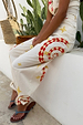 White Snake Tie Side Trousers with red and yellow snake and star motifs and multi-wear tie-ankle details.
