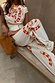 White Snake Tie Side Trousers in cotton twill with red snake motifs, styled as a wide leg co-ord with a matching top.