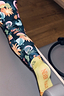 Thumbnail for Yellow cotton crew socks with orange branding on the sole, paired with sun and moon print leggings in a gym setting.