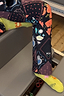 Thumbnail for Green Element cotton crew socks featuring sun and eye graphics, styled with patterned activewear leggings.