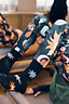 Thumbnail for Element cotton crew socks featuring colourful celestial prints, worn with matching patterned activewear.