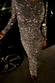 Thumbnail for Gunmetal Sequin Soho Dress with long sleeves and a shimmering finish in a motion-blurred party setting.