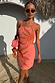 Pink Sol Beaded Wrap Skirt and matching top co-ord featuring an orange sun motif and gold sequins.