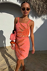 Pink Sol Beaded Wrap Skirt and matching top co-ord featuring an orange sun motif and gold sequins.