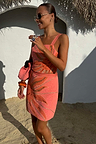 Pink Sol Beaded Wrap Skirt featuring a hand-embroidered sun motif and gold sequins, styled as a vacation co-ord.